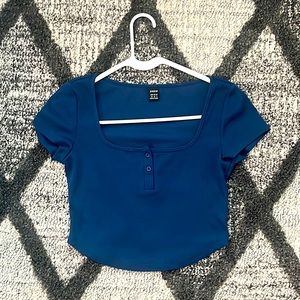 I’m selling a darkish blue button crop top! 💙